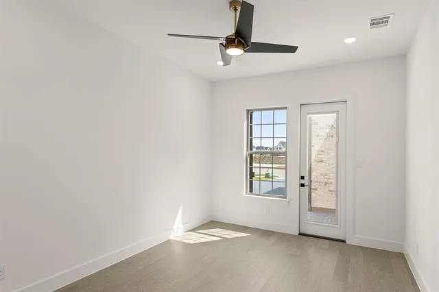 a spacious bathroom with a double vanity sink a mirror and a bathtub