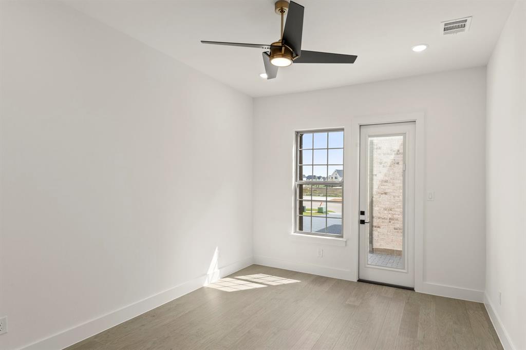 4416 Meander Way Prosper, TX 75078 - Photo 32 of 40 an empty room with windows