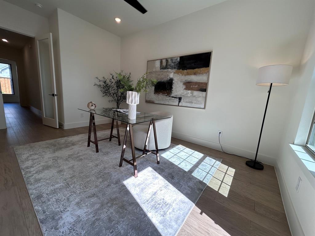 4416 Meander Way Prosper, TX 75078 - Photo 7 of 40 a workspace with furniture and wooden floor