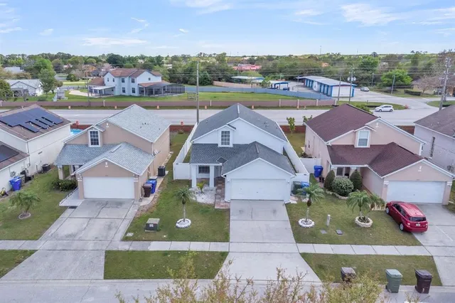 an aerial view of a house with a garden