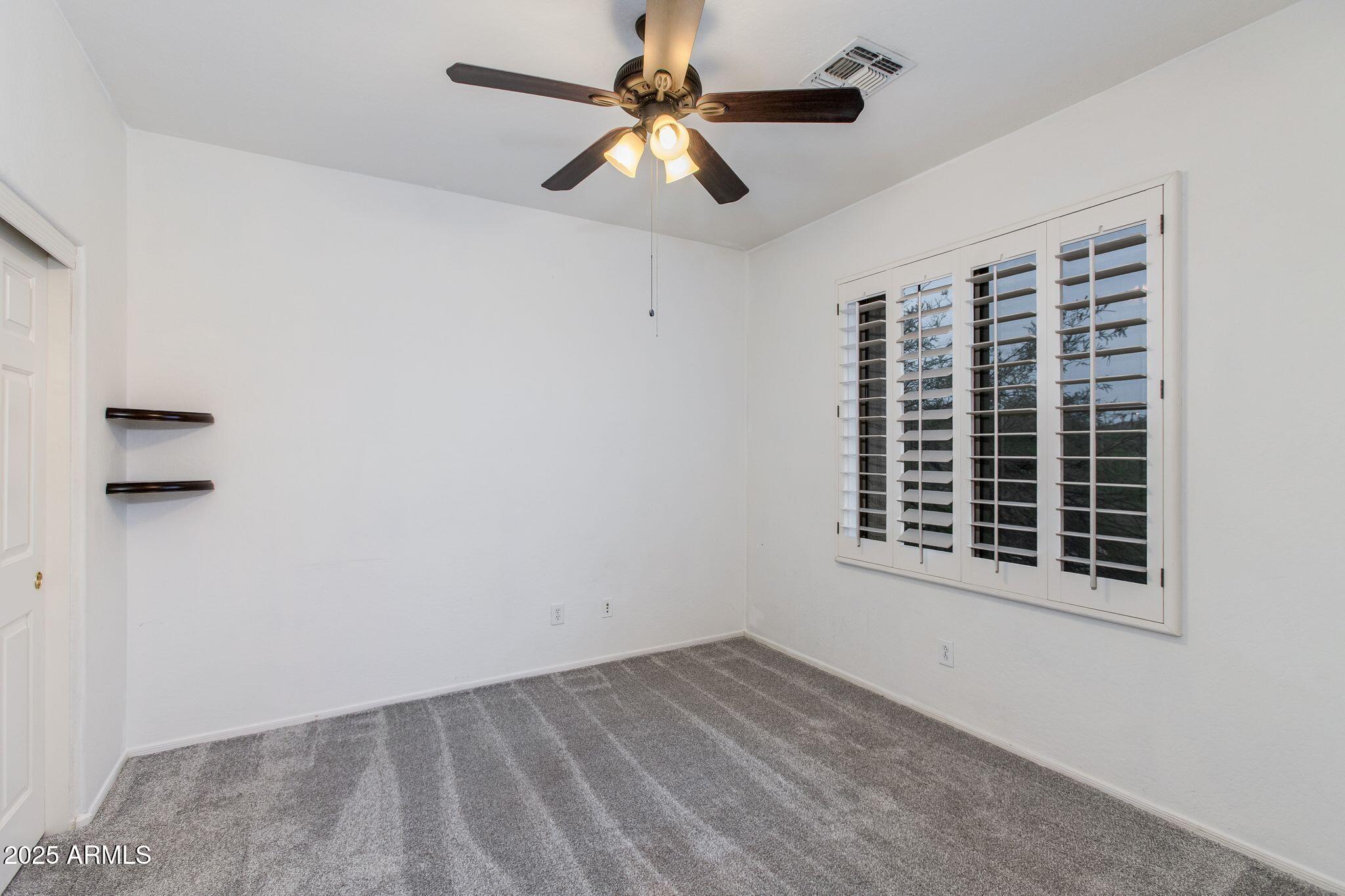 40332 North High Noon Way Phoenix, AZ 85086 - Photo 13 of 25 a view of an empty room with a window