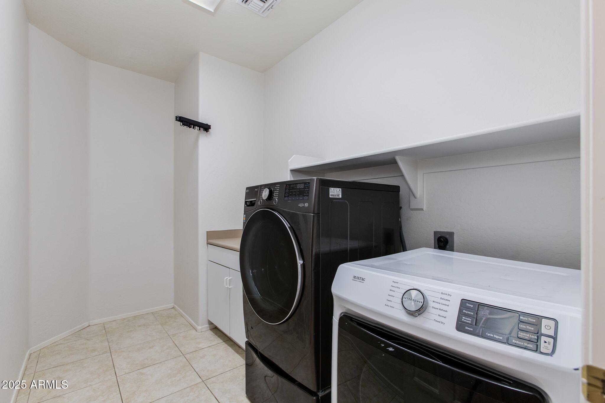 40332 North High Noon Way Phoenix, AZ 85086 - Photo 18 of 25 a utility room with dryer and washer