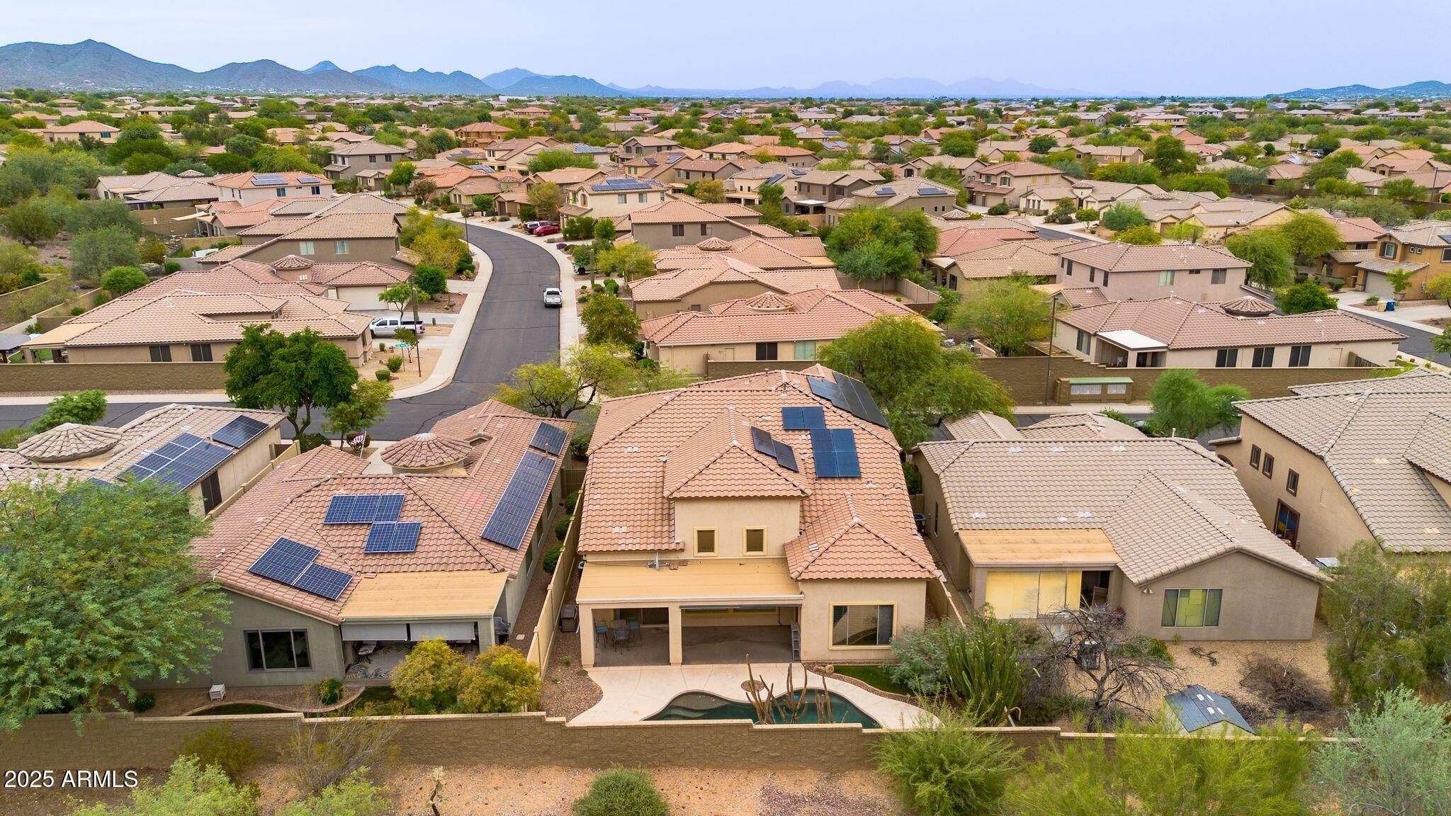 40332 North High Noon Way Phoenix, AZ 85086 - Photo 22 of 25 an aerial view of residential houses with outdoor space