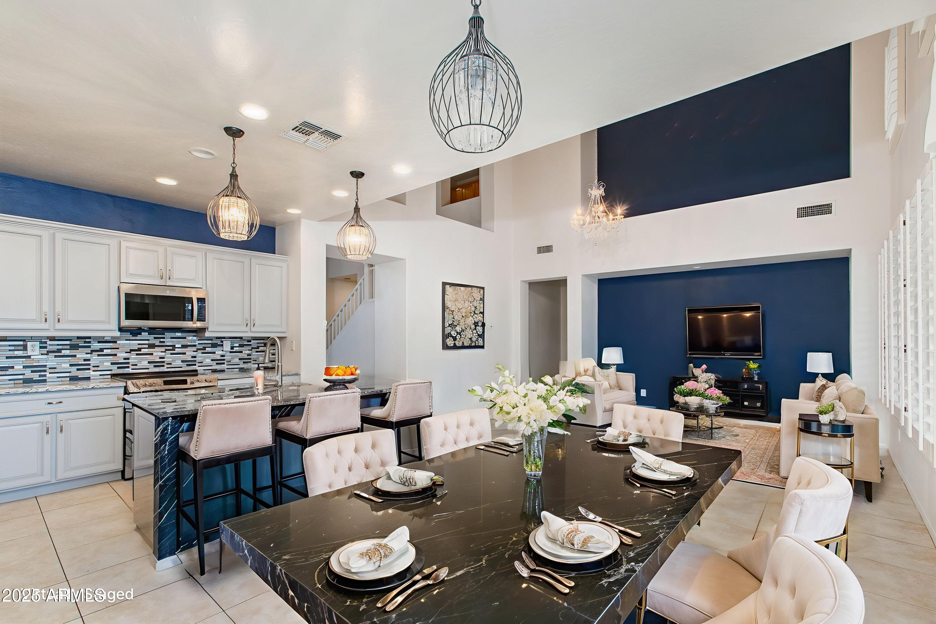 40332 North High Noon Way Phoenix, AZ 85086 - Photo 4 of 25 a view of a dining room with furniture