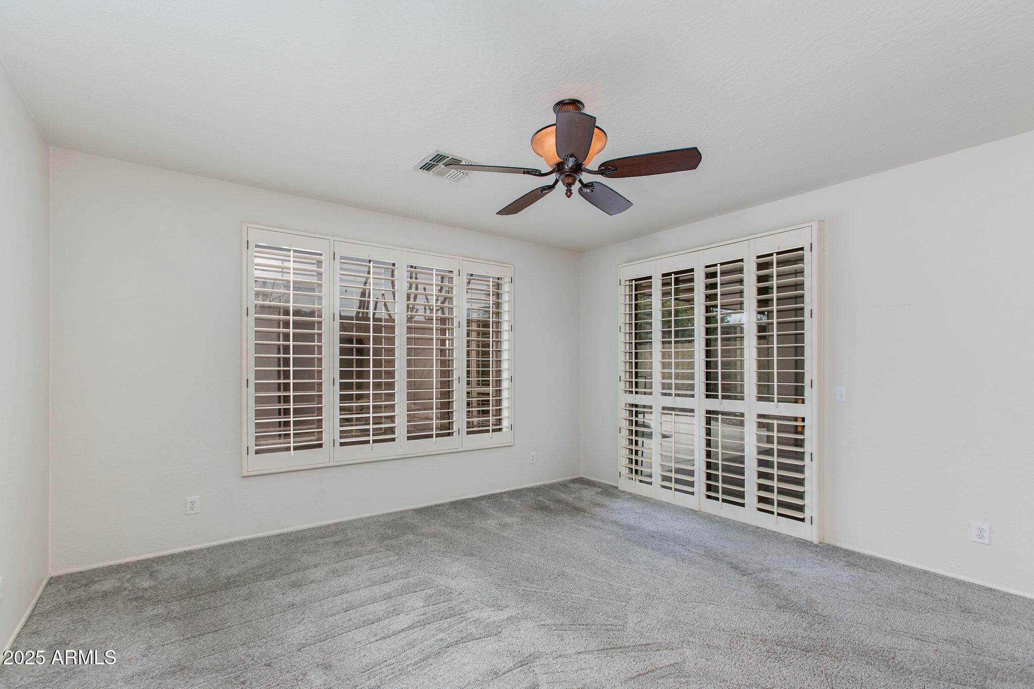 40332 North High Noon Way Phoenix, AZ 85086 - Photo 6 of 25 a view of an empty room with a window