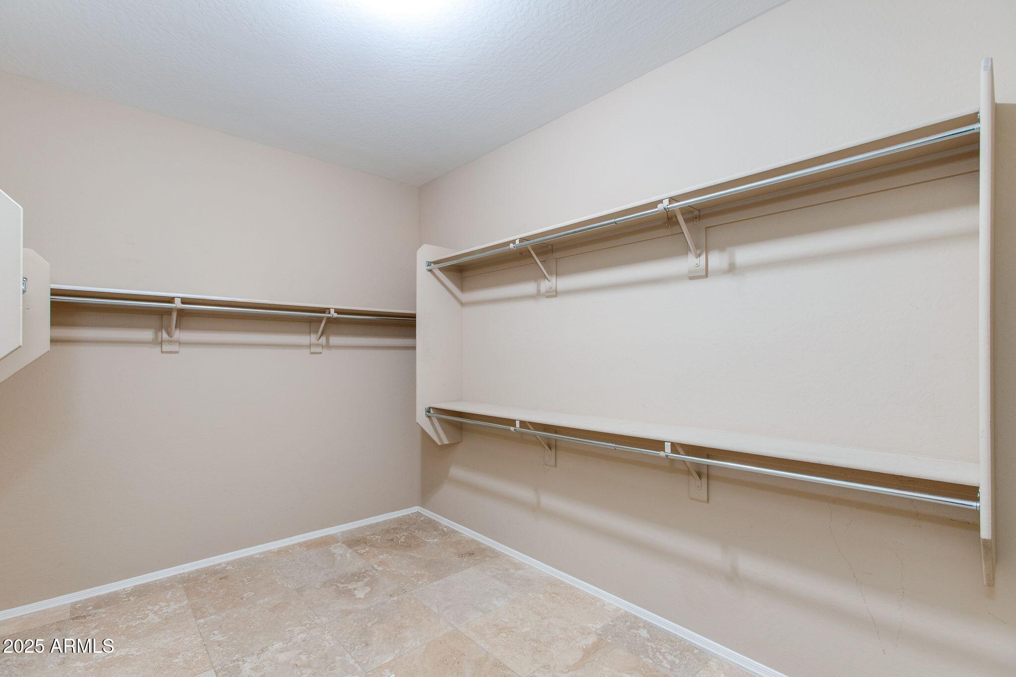 40332 North High Noon Way Phoenix, AZ 85086 - Photo 9 of 25 a view of an empty walk in closet