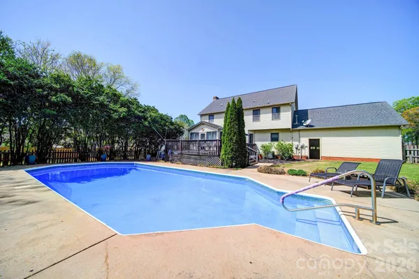 a view of a swimming pool with a lounge chairs