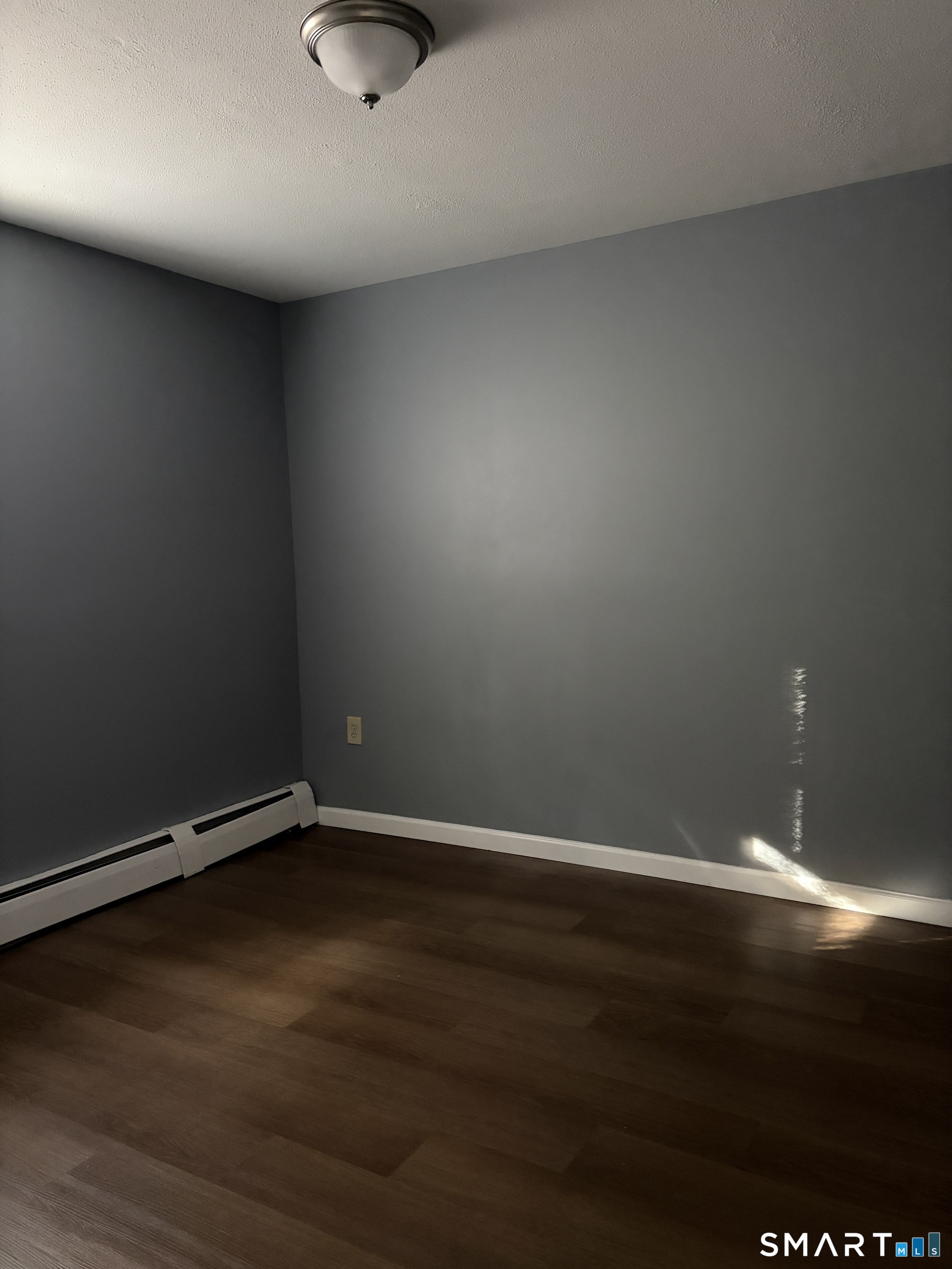 270 South Windham Road, Unit 63 Willimantic, CT 06226 - Photo 11 of 18 a view of an empty room and wooden floor