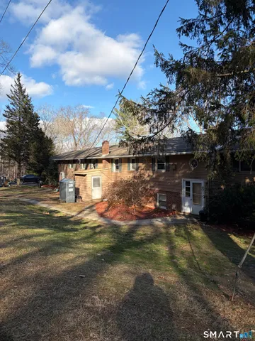 a view of a house with a yard