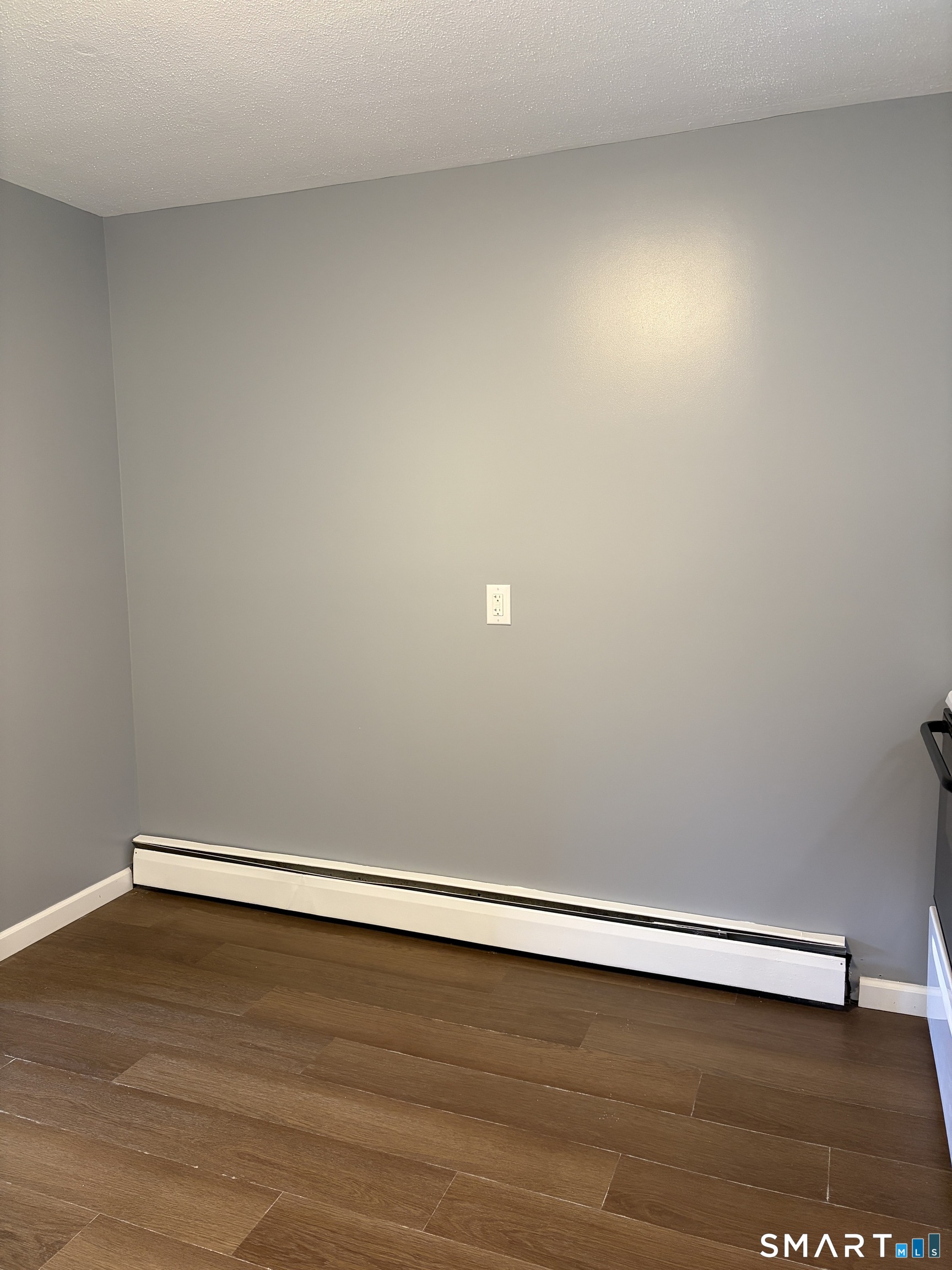 270 South Windham Road, Unit 63 Willimantic, CT 06226 - Photo 4 of 18 a view of an empty room with wooden floor