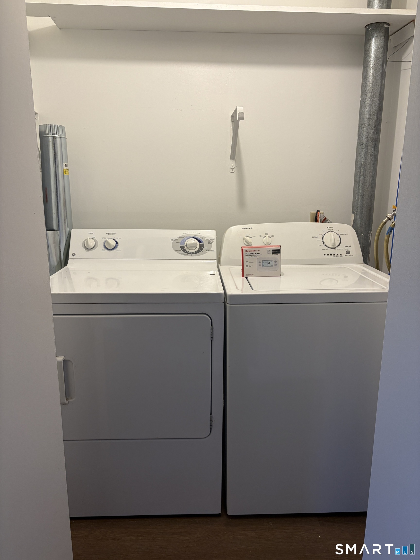 270 South Windham Road, Unit 63 Willimantic, CT 06226 - Photo 7 of 18 a utility room with dryer and washer