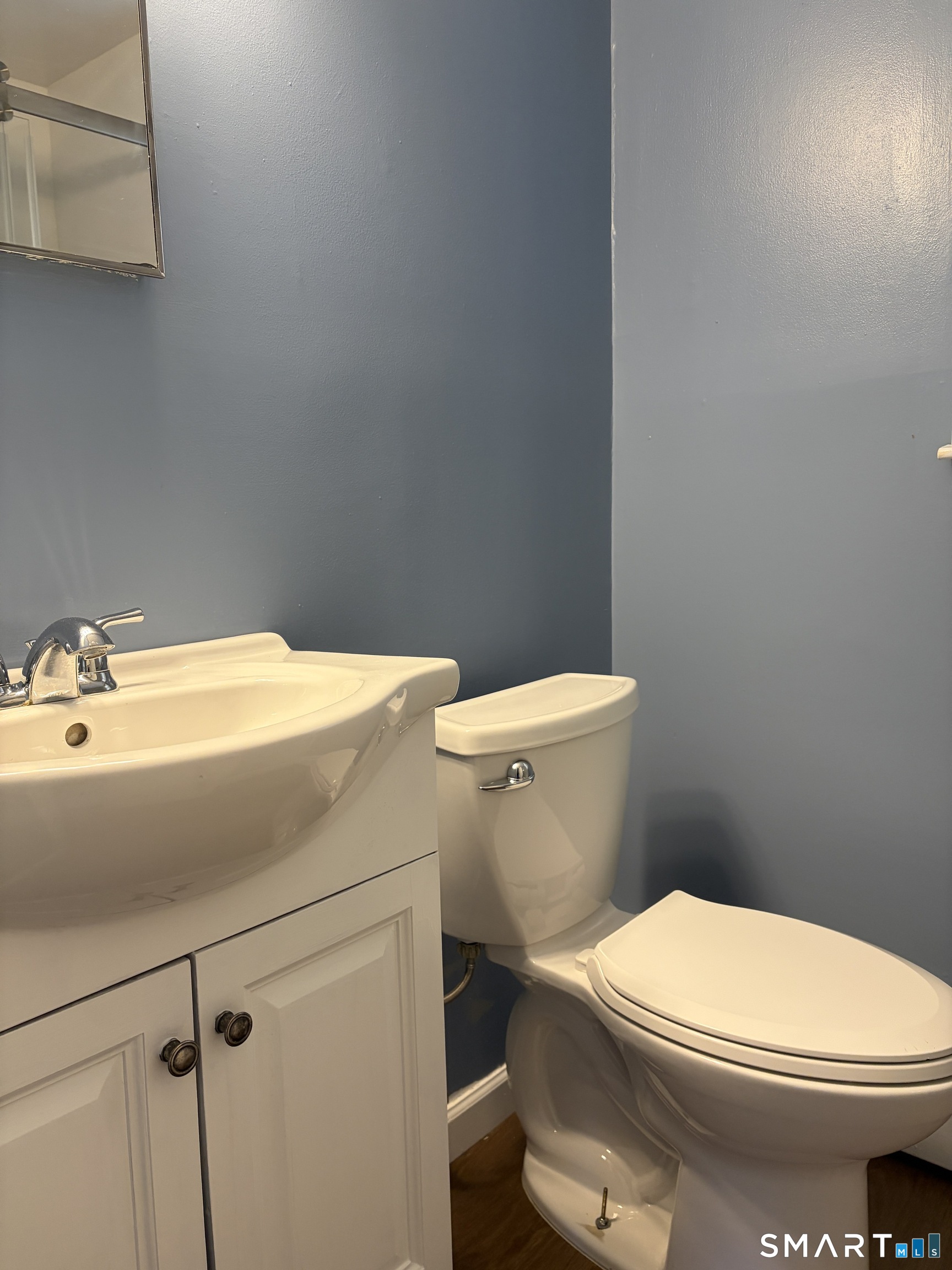 270 South Windham Road, Unit 63 Willimantic, CT 06226 - Photo 8 of 18 a bathroom with a toilet and a sink