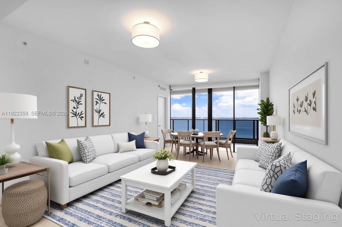 700 Northeast 24th Street, Unit 2003 Miami, FL 33137 - Photo 14 of 87 a living room with furniture and a large window