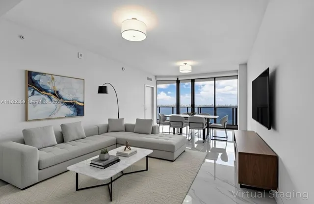a bathroom with a double vanity sink a mirror and next to a window
