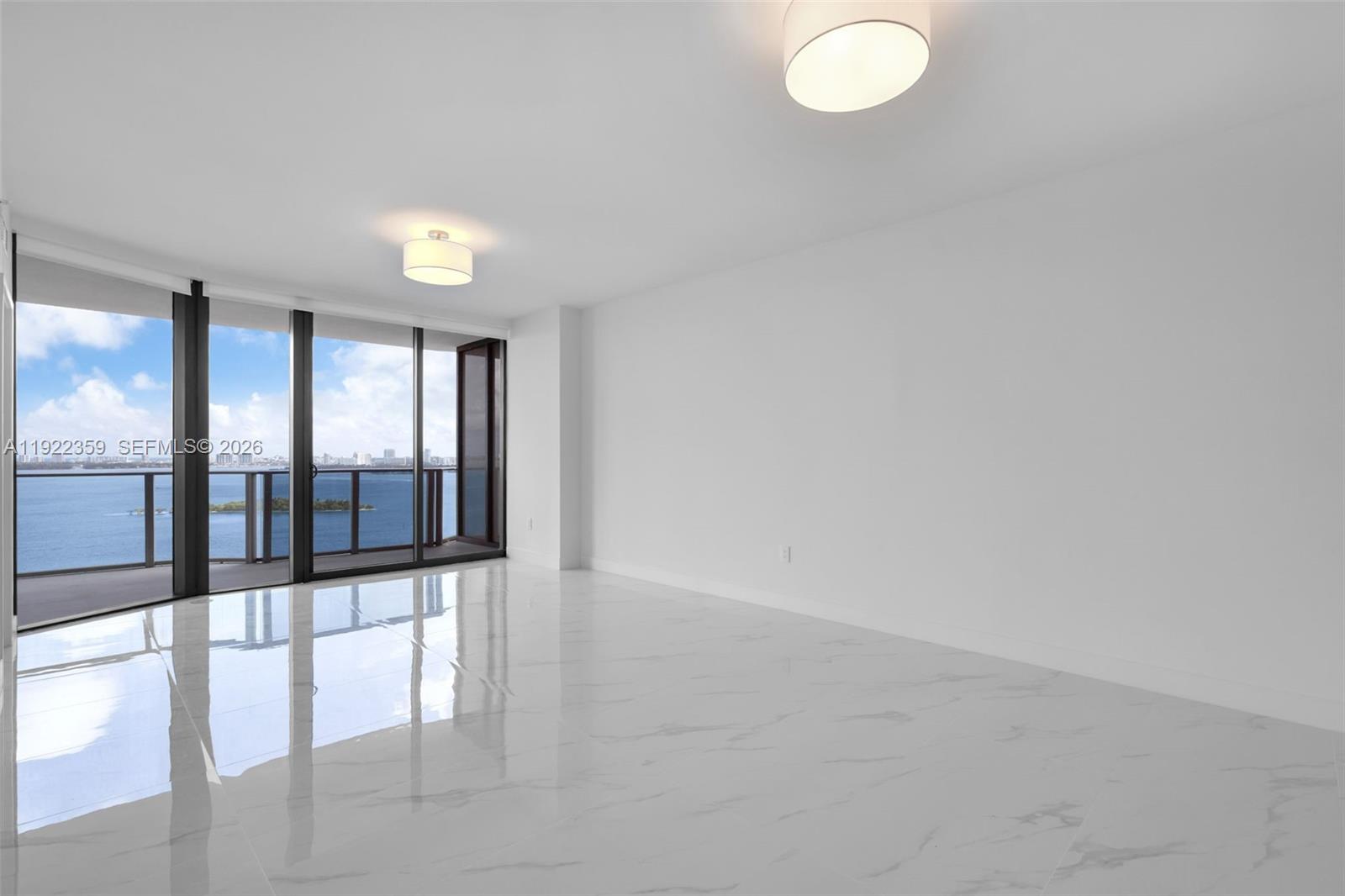 700 Northeast 24th Street, Unit 2003 Miami, FL 33137 - Photo 18 of 87 wooden floor in an empty room with a window