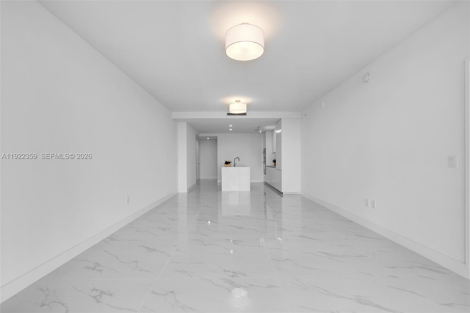 700 Northeast 24th Street, Unit 2003 Miami, FL 33137 - Photo 19 of 87 a view of empty room with wooden floor