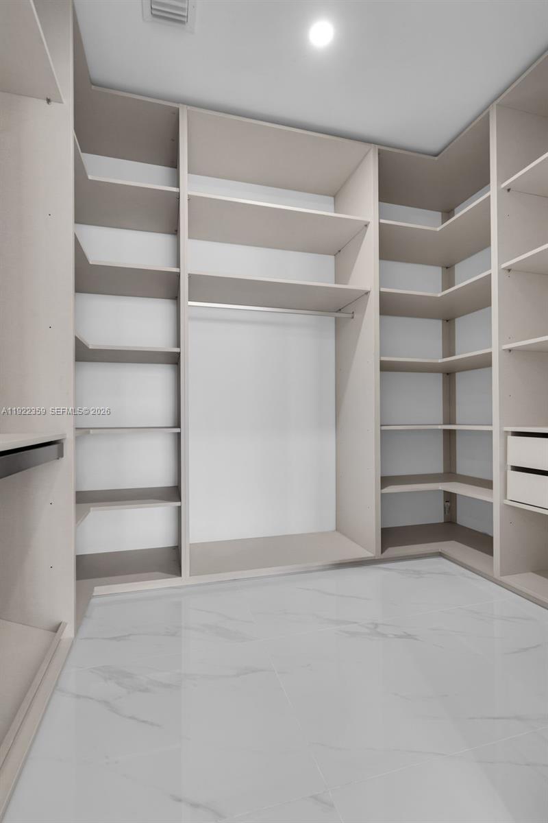 700 Northeast 24th Street, Unit 2003 Miami, FL 33137 - Photo 32 of 87 a view of an empty walk in closet