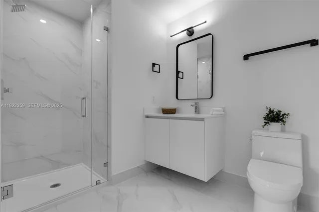 a bathroom with a bathtub and a large window