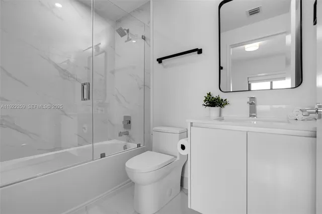 a view of a chairs and table in a patio