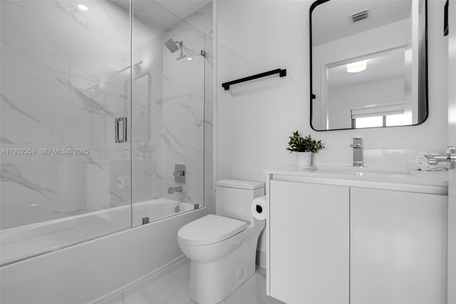 700 Northeast 24th Street, Unit 2003 Miami, FL 33137 - Photo 37 of 87 a bathroom with a sink a toilet and shower