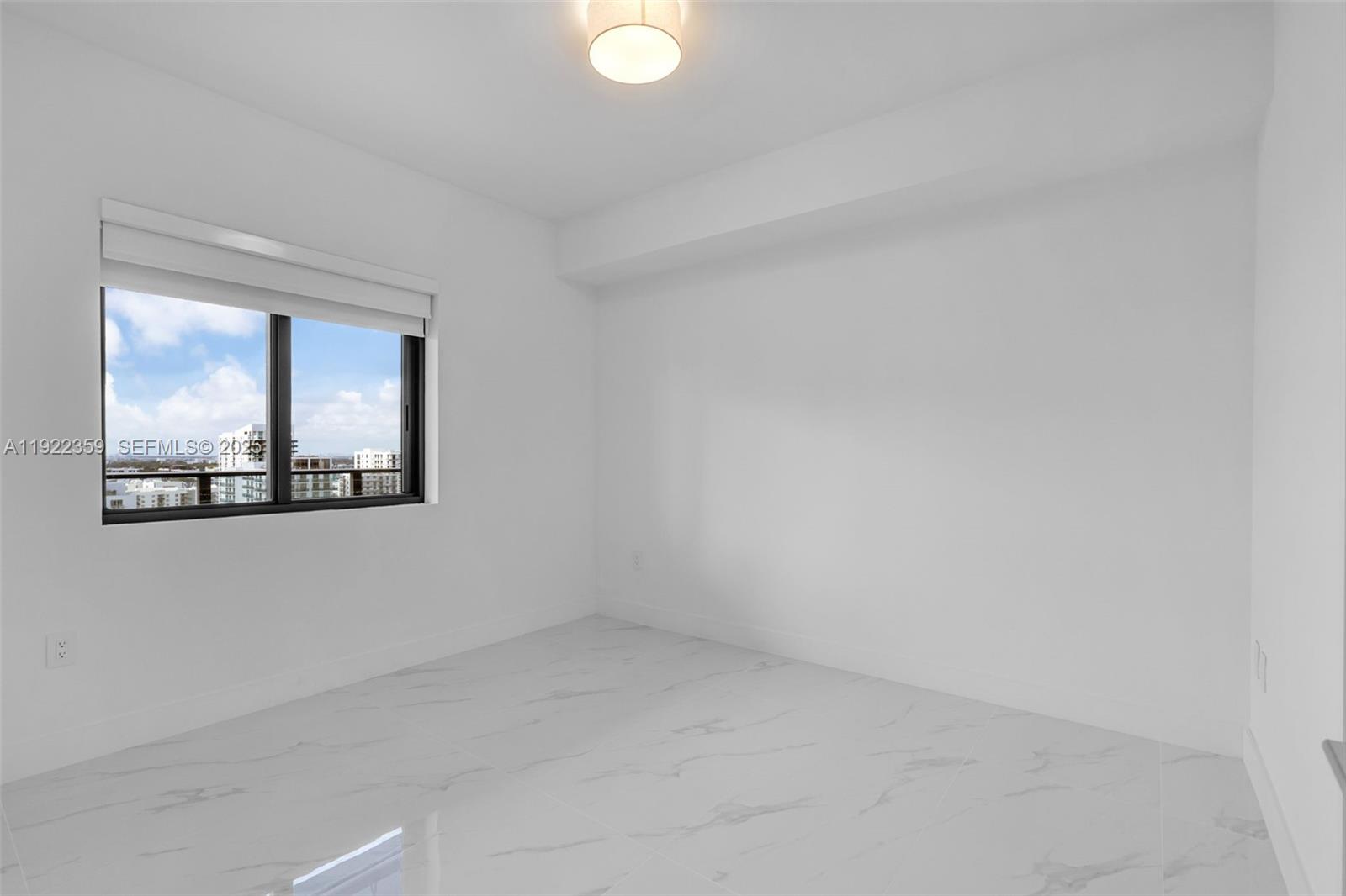 700 Northeast 24th Street, Unit 2003 Miami, FL 33137 - Photo 39 of 87 an empty room with a window