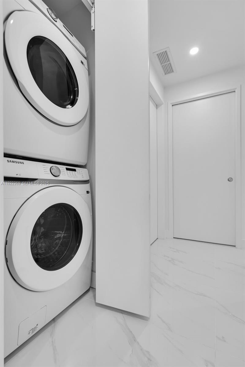 700 Northeast 24th Street, Unit 2003 Miami, FL 33137 - Photo 43 of 87 a utility room with dryer and washer