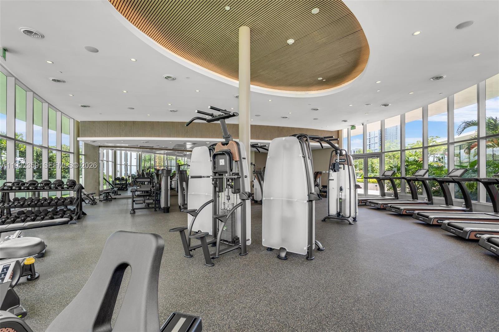 700 Northeast 24th Street, Unit 2003 Miami, FL 33137 - Photo 47 of 87 a view of a room with gym equipment
