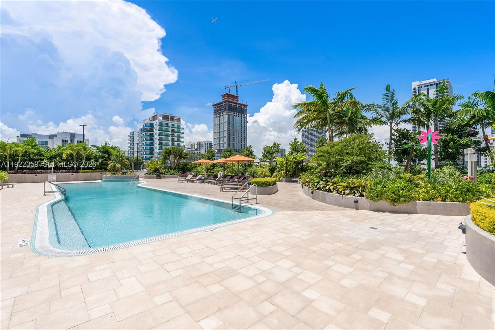 700 Northeast 24th Street, Unit 2003 Miami, FL 33137 - Photo 68 of 87 a view of a swimming pool and a yard