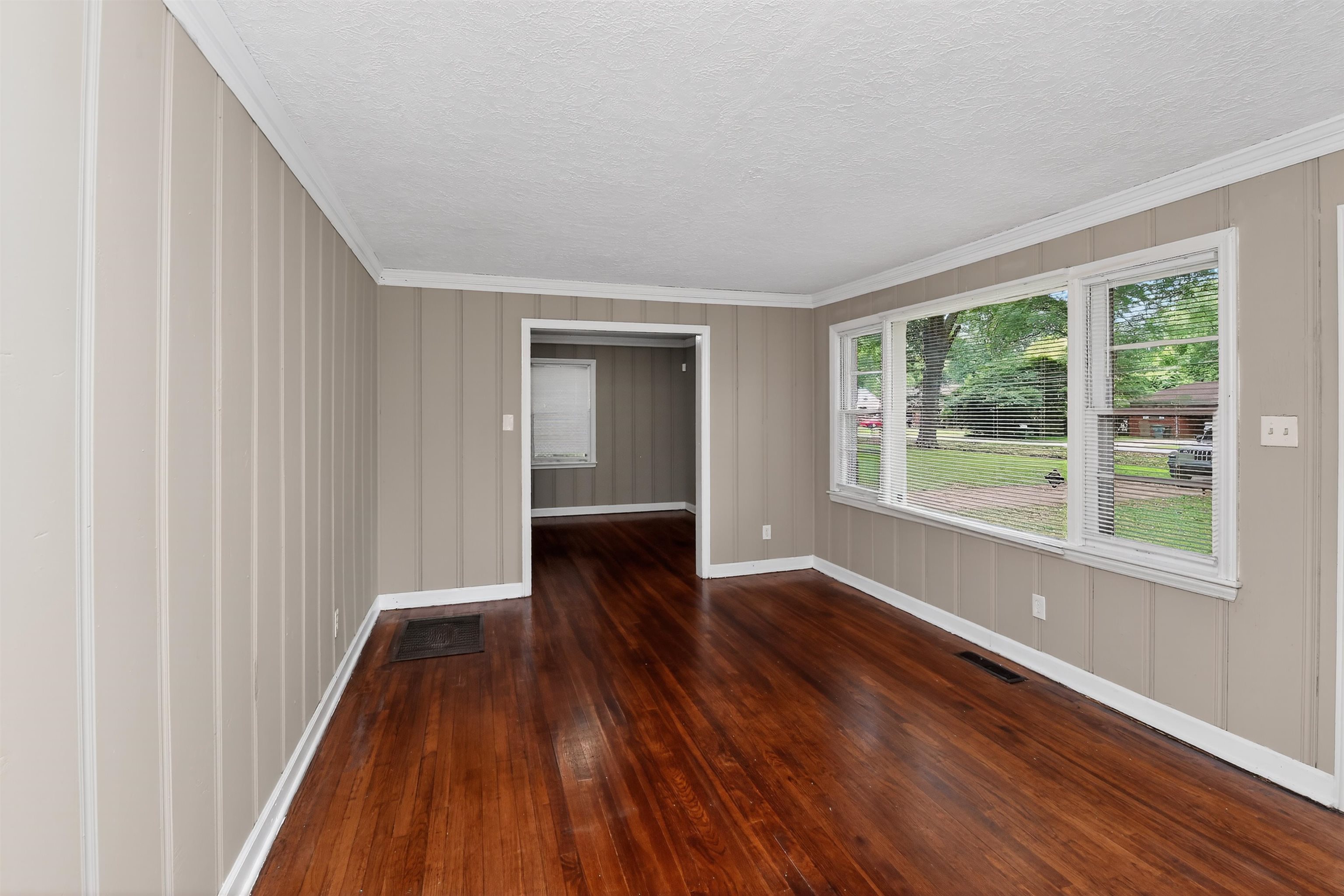 2840 Allen Road Memphis, TN 38128 - Photo 15 of 31 Spacious interior featuring wood-finish flooring, vertical paneling, and white trim