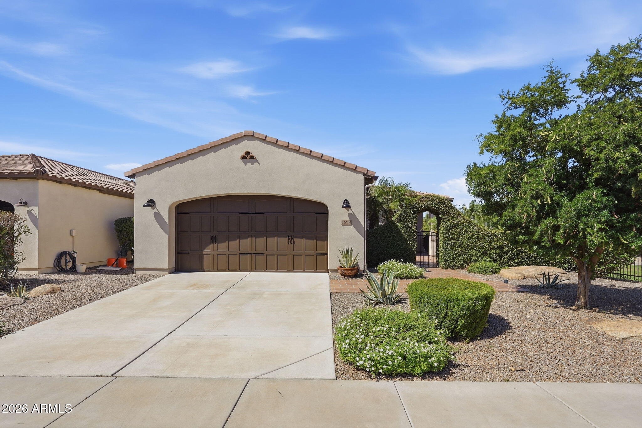 1694 East Grand Ridge Road Queen Creek, AZ 85140 - Photo 45 of 61 a front view of a house with a yard