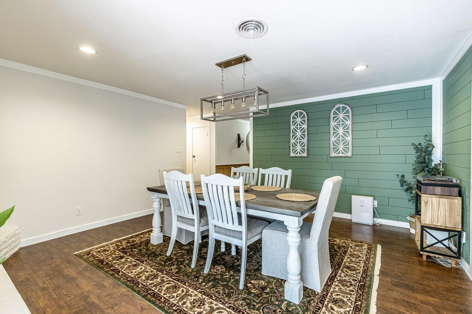 3604 48th Street Lubbock, TX 79413 - Photo 11 of 50 a view of a dining room with furniture window and wooden floor