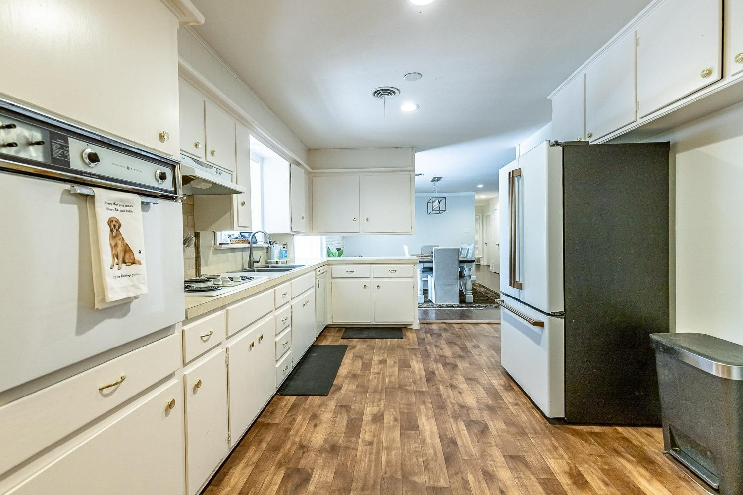 3604 48th Street Lubbock, TX 79413 - Photo 17 of 50 a kitchen with stainless steel appliances a refrigerator sink and cabinets