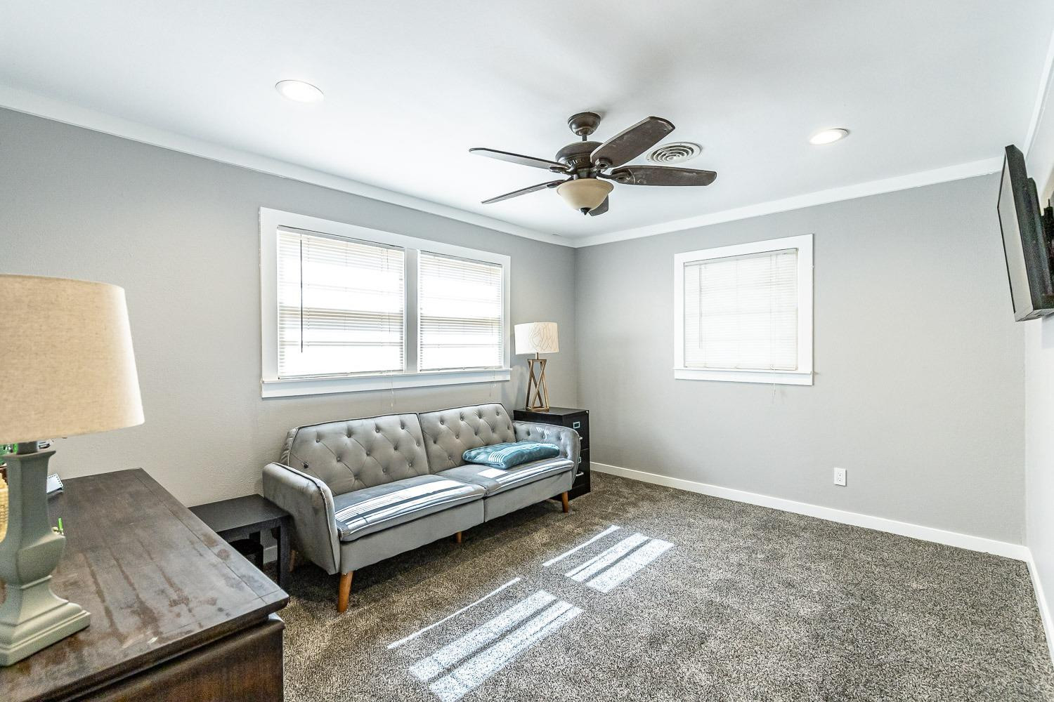 3604 48th Street Lubbock, TX 79413 - Photo 27 of 50 a living room with furniture and a window