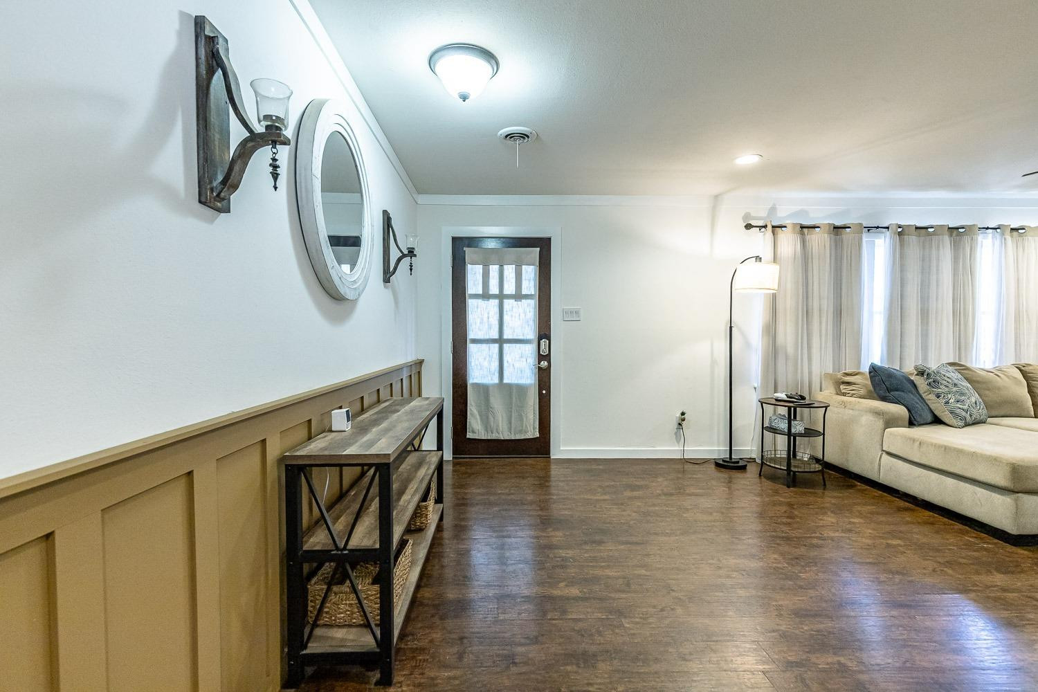 3604 48th Street Lubbock, TX 79413 - Photo 3 of 50 a view of a livingroom with furniture and hardwood floor