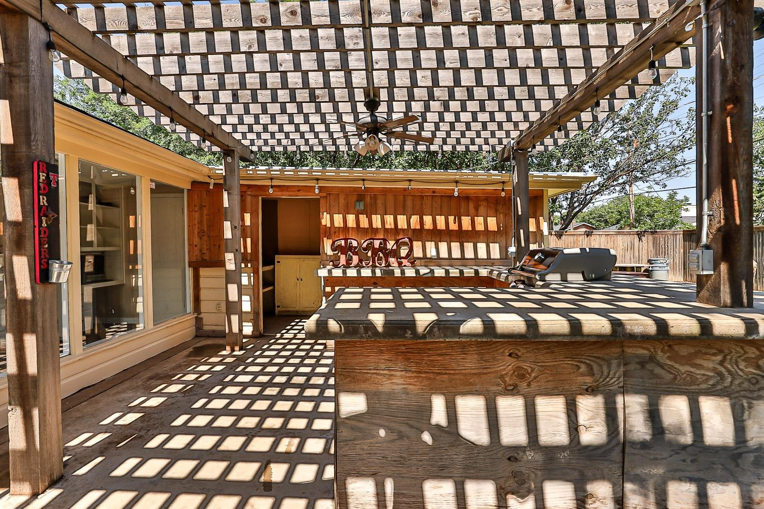3604 48th Street Lubbock, TX 79413 - Photo 38 of 50 a view of a porch with a bench