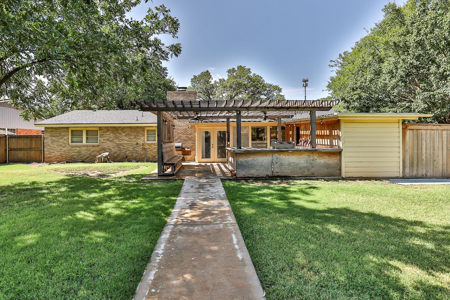 3604 48th Street Lubbock, TX 79413 - Photo 43 of 50 a front view of a house with a yard and lake view