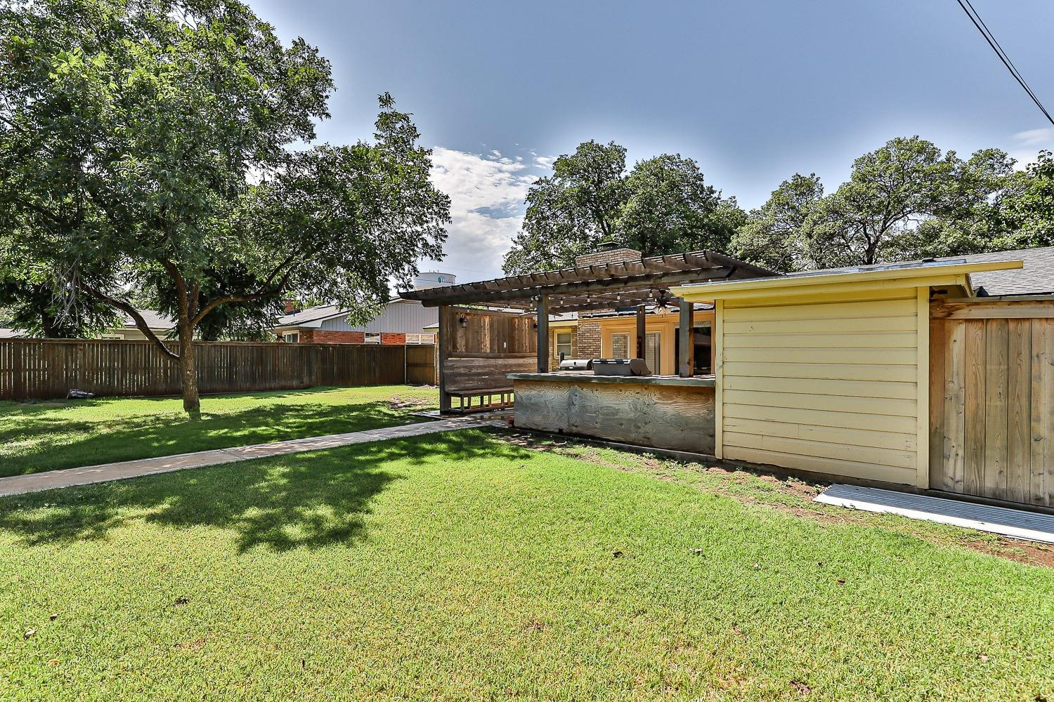 3604 48th Street Lubbock, TX 79413 - Photo 45 of 50 a front view of house with yard and green space