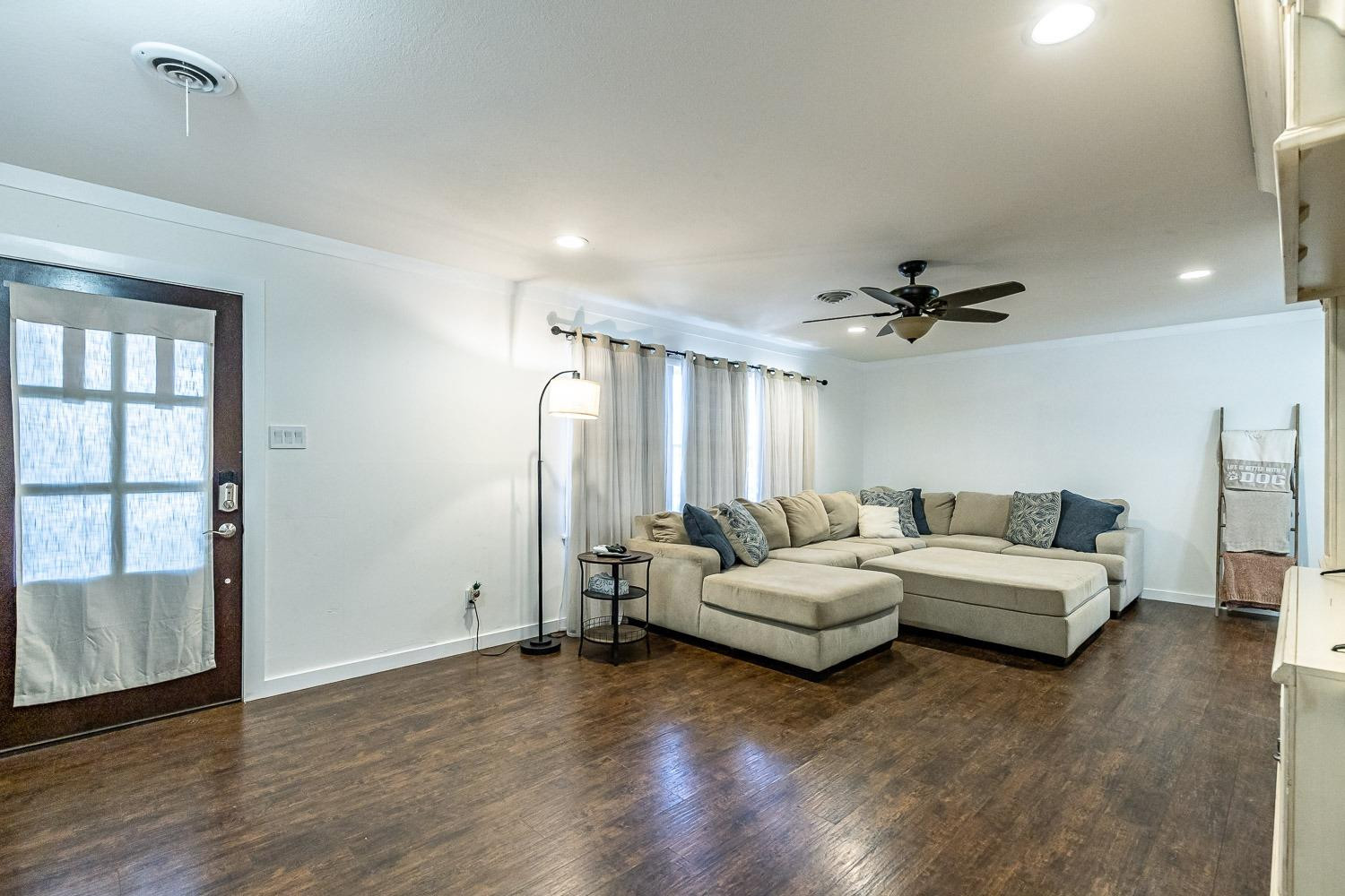 3604 48th Street Lubbock, TX 79413 - Photo 5 of 50 a living room with furniture and a large window