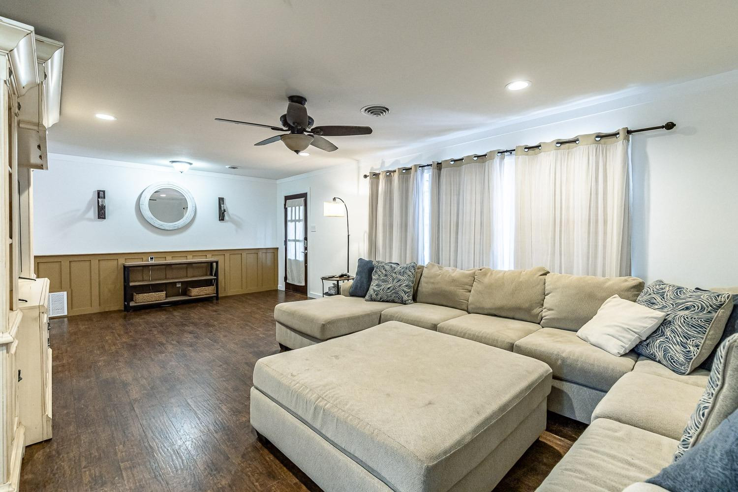 3604 48th Street Lubbock, TX 79413 - Photo 6 of 50 a living room with furniture and a large window