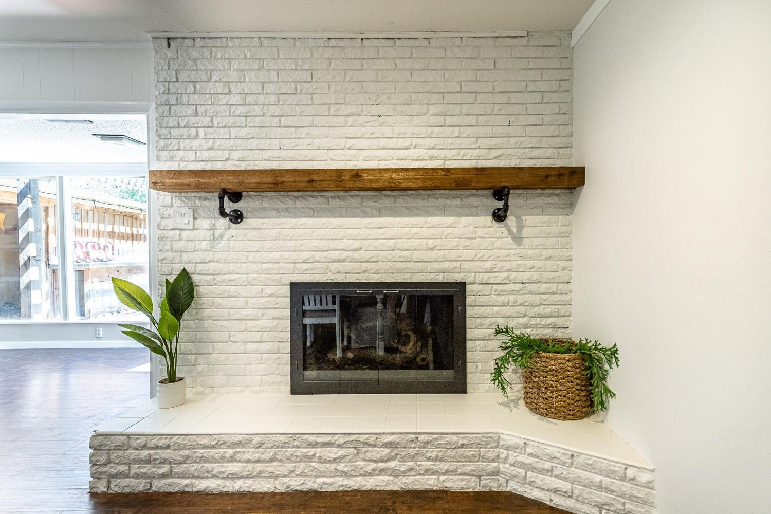 3604 48th Street Lubbock, TX 79413 - Photo 10 of 50 a living room with furniture and a fireplace