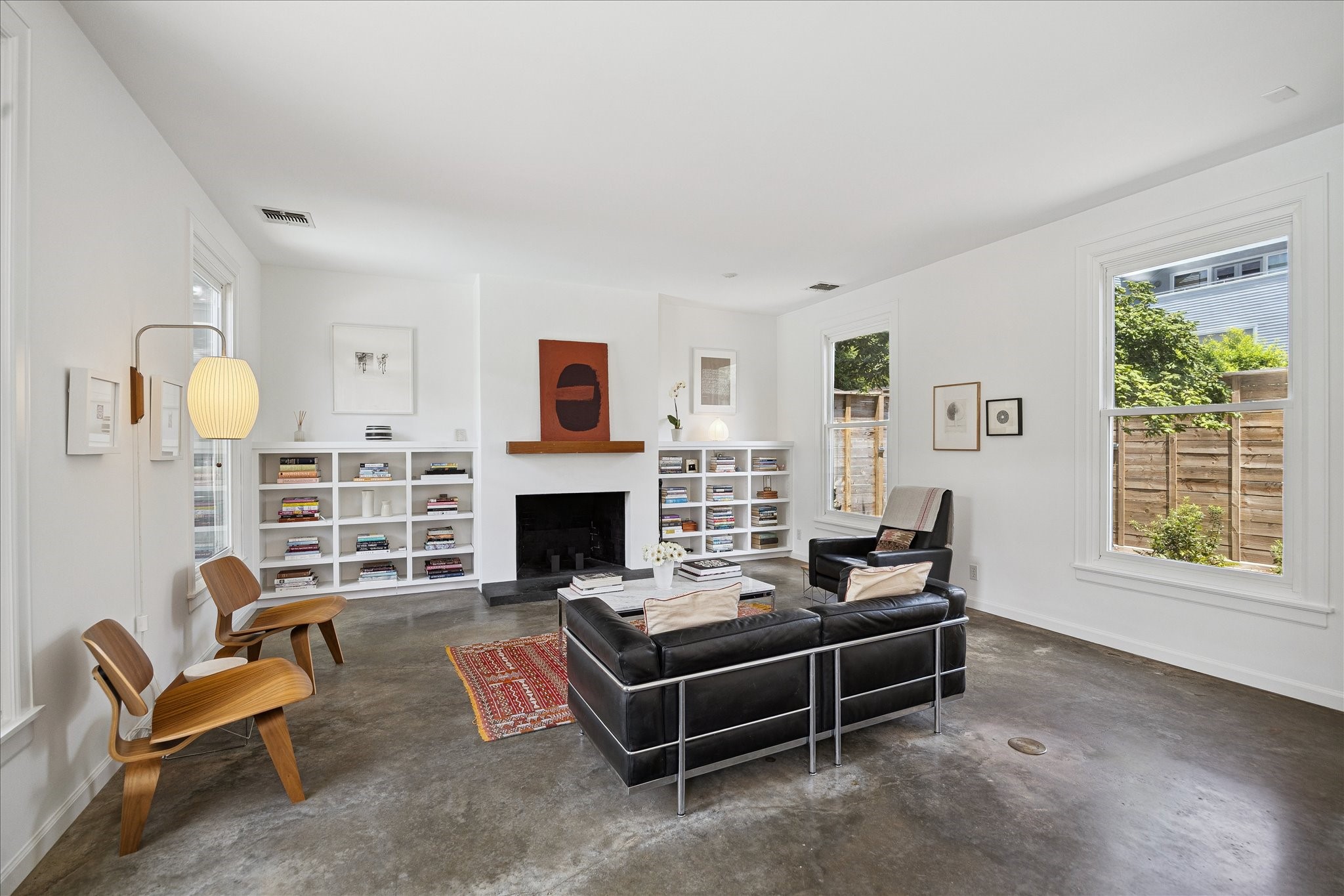 1418 Kipling Street Houston, TX 77006 - Photo 6 of 42 Upon entering the home, the living area is to your left. High ceilings, double pane windows, and the recent interior paint makes the space feel unobstructed and open.