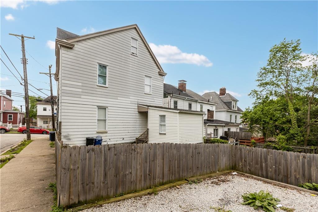 17 Lelia Street Pittsburgh, PA 15211 - Photo 26 of 26 a backyard of a house with wooden fence