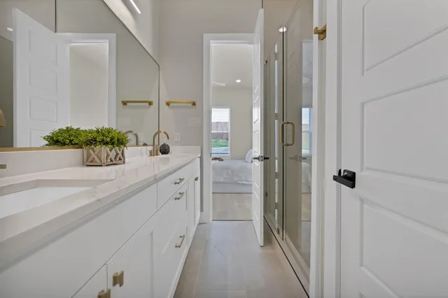 a bathroom with a sink and mirror