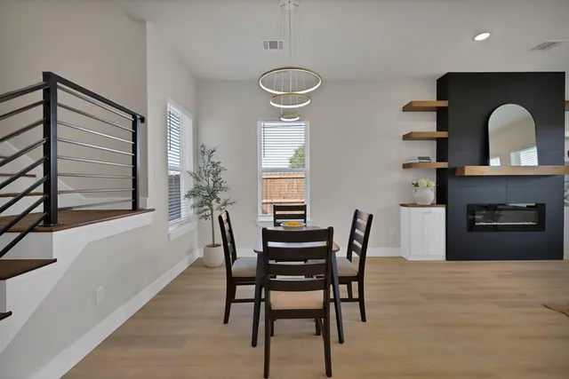 a dining room with furniture and window