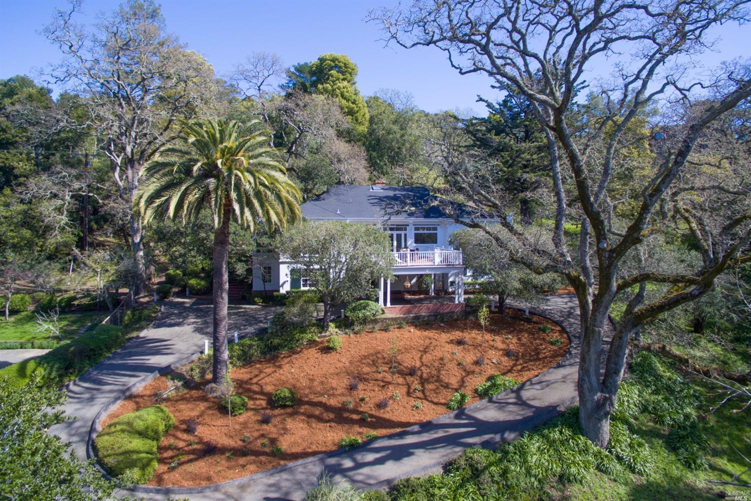 9 Wolfe Glen Way Kentfield, CA 94904 - Photo 1 of 1 a view of a house with a yard covered with snow in the background