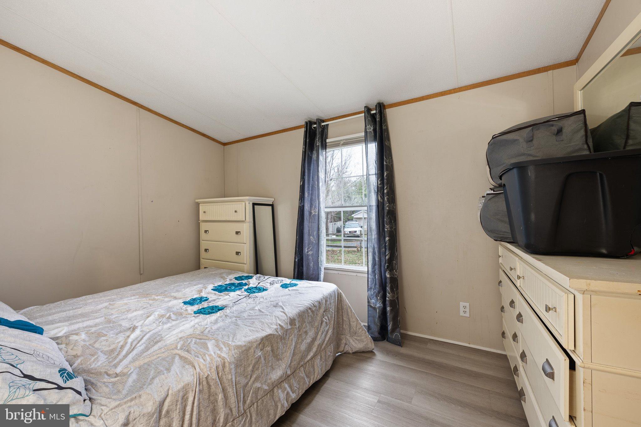 1650 Cypress Branch Road Magnolia, DE 19962 - Photo 23 of 35 Cozy bedroom with natural light and charm.