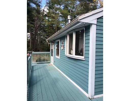 20 Crooked River Road Wareham, MA 02571 - Photo 1 of 14 a porch with a sink and balcony