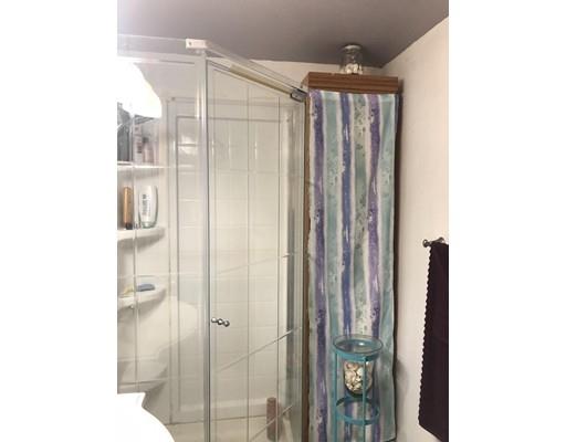 20 Crooked River Road Wareham, MA 02571 - Photo 14 of 14 a bathroom with a shower and a mirror