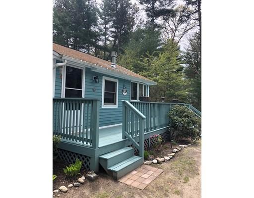 20 Crooked River Road Wareham, MA 02571 - Photo 3 of 14 a view of a house with a small yard and wooden floor and fence