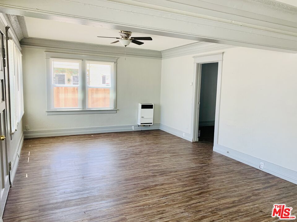 219 East 10th Street Long Beach, CA 90813 - Photo 17 of 26 a view of a livingroom with wooden floor and a window
